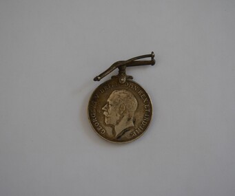 Round white metal medal with bent bar attachment