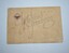 Cream coloured cardboard card with red white and grey symbol top left corner above two words in black print
