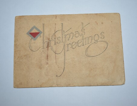 Cream coloured cardboard card with red white and grey symbol top left corner above two words in black print