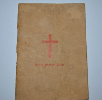 Cream colour cardboard cover booklet with red cross on cover containing 80 pages.