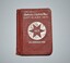 Small red canvas bound booklet with silver writing and symbols on front and back cover with pencil housed in spine.