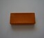  Small oblong shaped box with lid covered in tan colour paper containing newspaper cuttings