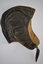 Brown leather flying helmet with buckle chinstrap and small buckled loop on the rear to retain goggles.  External earpiece openings are secured by a pair of snap fasteners with brown plastic caps.