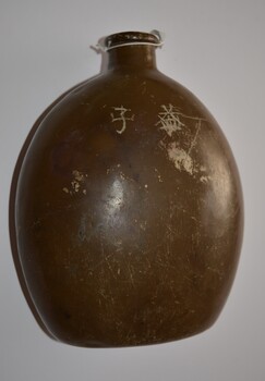 Brown painted aluminium kidney shaped water canteen.