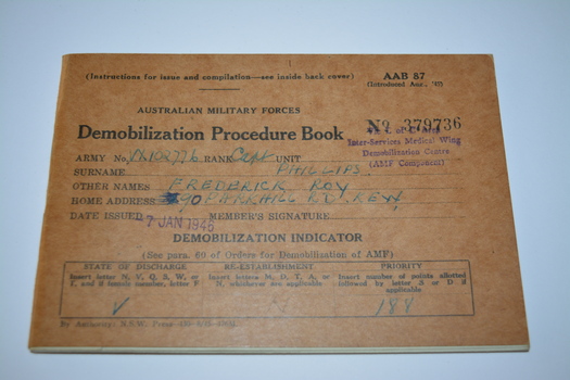 Small booklet with brown cardboard cover with printing in black ink