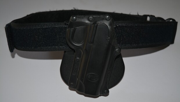 Black Velcro belt with short black holster attached