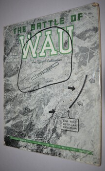 Soft cover booklet covered in plastic contains 32 pages including maps and illustrations.  Cover has black and white copy of aerial photograph with writing highlighted in green.