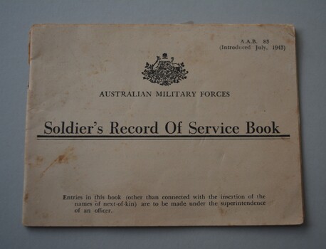 Cream paper booklet with crest and lettering in black ink on front cover containing 20  pages