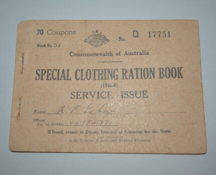 Brown cardboard booklet with  lettering in black ink on front cover containing 2 half  pages