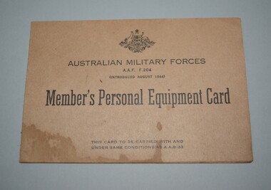 Cream cardboard card fold in half with crest and lettering in black ink on front cover 