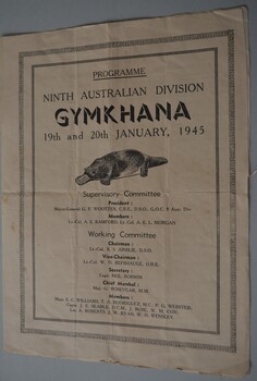 Large beige coloured  paper folded in half to form four pages with black image of a platypus and lettering on cover