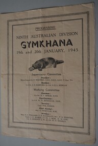 Large beige coloured  paper folded in half to form four pages with black image of a platypus and lettering on cover