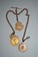 Gold fob chain with three gold medallions attached.  All three medallions have an image of a soldier with rifle with inscription engraved on reverse side.