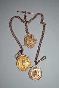 Gold fob chain with three gold medallions attached.  All three medallions have an image of a soldier with rifle with inscription engraved on reverse side.