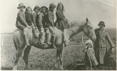 Black and white photograph, Overcrowded Private Transport circa 1915