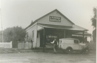 Black and white photograph, Louis Park's Saddlery Shop, Montgomery St., Lake Bolac, 1946