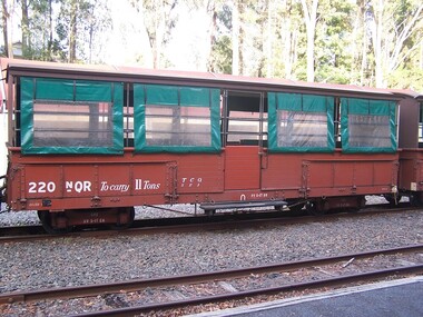 220 NQR - Open medium truck with seats & canopy, between 1990 and 1992