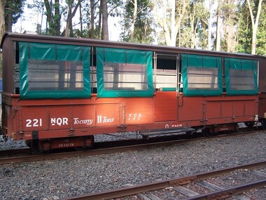 221 NQR - Open medium truck with seats & canopy, between 1990 and 1992