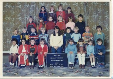 Four Rows of Children, with a woman centre of the front row