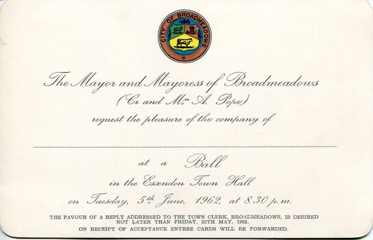 Cream printed invitation card issued by the Mayor and Mayoress of Broadmeadows, featuring a coloured municipal seal at the top and formal script inviting attendance at a civic ball at Essendon Town Hall on 5 June 1962, with a plain verso showing a small accession label.
