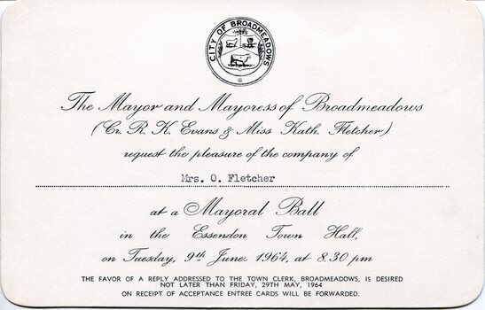 Cream‑coloured invitation card with rounded corners, featuring the City of Broadmeadows crest and formal black text inviting the named recipient to a Mayoral Ball at Essendon Town Hall on Tuesday, 9 June 1964 at 8.30 pm.