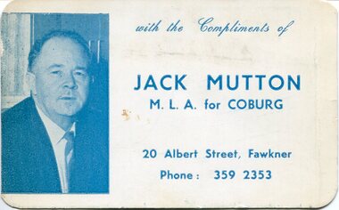 A small blue and white pocket calendar card featuring a halftone portrait and printed political text, with rounded corners and visible wear.