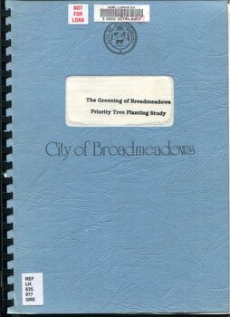Front cover of a blue comb bound report titled “The Greening of Broadmeadows: Priority Tree Planting Study.” The cover features a cut out window showing the printed title, a City of Broadmeadows crest, library barcode and reference labels, and a “Not for loan” sticker.