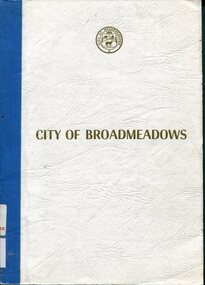 Front cover of a 1985 Broadmeadows municipal report featuring a textured white card cover, the City of Broadmeadows civic seal near the top, prominent gold “CITY OF BROADMEADOWS” lettering across the centre, and a blue cloth-bound spine visible along the left edge.