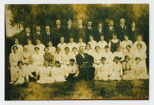 Postcard in sepia of Chelsea Choral Society taken in 1917. A framed version presented to Fred Frewin choirmaster (seated in front row) for services.