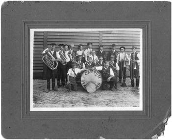Carrum Brass Band and their instruments in front of their practice hall.