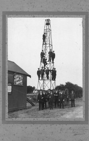 Chelsea Fire Brigade members, standing in front of Fire Station and on the bell tower.