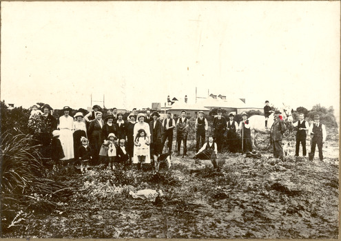 P01029 Chelsea State School men with spades planting a garden