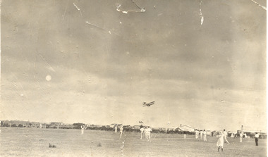 P00479 Cricketers in Brown's paddock plane above