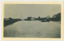 P00062 Men in lifeboat taking supplies to Wells Rd farms 1934 Postcard