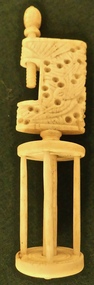 Tool - One of a pair of Bone Winding Clamps, carved base, decorated with birds. Topped by rotating cage with four uprights and central spindle, joining two discs. Top Finial missing lower bone screw, 1840's
