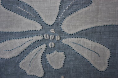  Blue and white cotton mat with applique flowers
