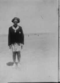 000054 - Photograph - 1939 Inverloch - Abbott St Beach - Gladys Bate wearing school uniform - Daughter of Shire Engineer