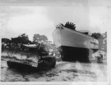 Photograph, Inverloch - Ripple 2 pulled by dozer onto Western Beach for launching