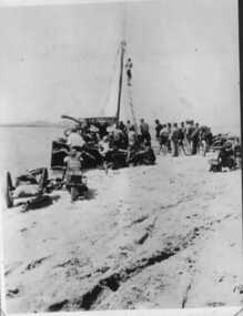 000156 - Photograph - 27 Jan 1935 - Pt Smythe - Loading Motor Cycles onto William (Bill) Campbell Young's boat Irene (Crayfish) - Bikes Right  Panther (Alan Gray) , Left  Coventry Eagle Northcote Races held on back beach speeds of 100mph reached