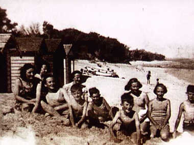000211 - Photograph - Bathing boxes - Inverloch - Abbott St - Dinghy in background built by Bill Young - Fiona Dixon -  R Young