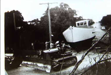 000820 - Photograph - Inverloch - Ripple II being pulled by bulldozer  in Abbott St - from Max Annand
