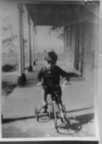 000180 - Photograph - 1937 - John Henderson (child) on Tricycle - from E Henderson