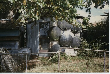 000705 - Photograph - 1997 - Korumburra - Bob Newton Museum - Furphy lids