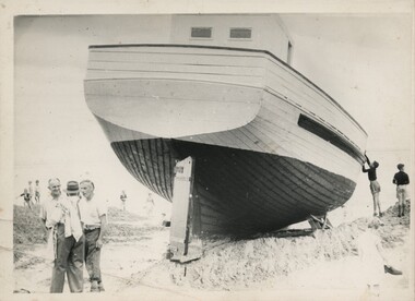 004389 - Photograph - 29 November 1959 - Ripple II on dune being examined by two boys on right and three men in front - from Bob Young