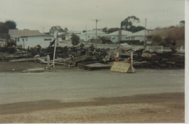 000924 - Photograph - 1982 - Inverloch - Cnr Reilly and A'Beckett Sts - Mechanics Hall and Library remains morning after fire - Hazel Swift