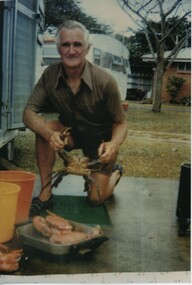 000964 - Photograph - Inverloch - George Treadwell seated at caravan park - from Isobel Treadwell