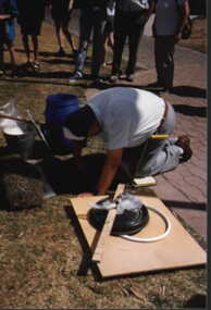 001216 Photograph - January 1998 - Norman Deacon planting the Time Capsule - from P Jones