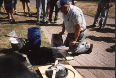 001217 Photograph - January 1998 - Norman Deacon placing items in Time Capsule - from P Jones