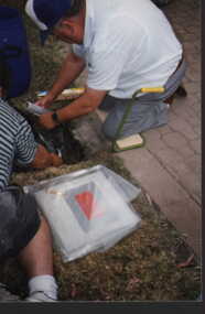 001225 Photograph - January 1998 - Bass Bicentenary Time Capsule - Norm Deacon sealing the capsule with gladwrap - from P Jones