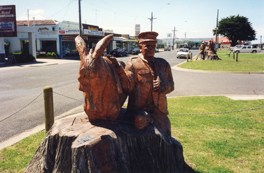 Photograph - Memorial Cypress tree Carvings by John Brady Esplanade Lakes Entrance 1998
